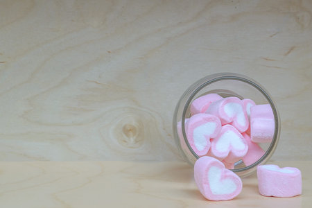 Heart shape pink marshmallow in glassの写真素材