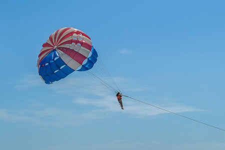 Parasailing extreme sports in blue sky background