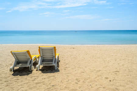 Beach chairs on White Sand Beach with blue sky in Phuket,Thailandの写真素材