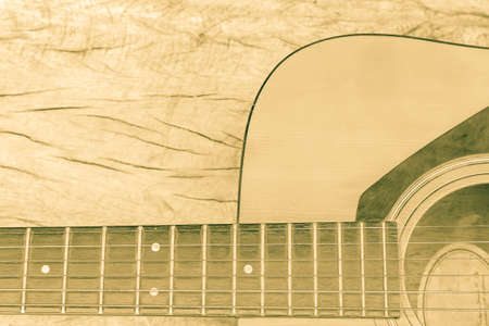 Classic guitar in vintage tone on wood backgroundの写真素材