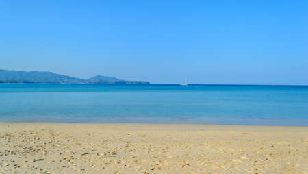 Layan beach with blue sky in Phuket Island,Thailandの写真素材