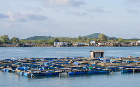 Scenery of a floating basket for keeping live fish in water sea in phuket,Thailandの写真素材