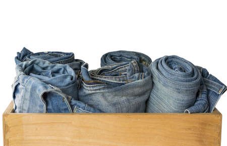 Blue denim jeans texture in wooden box with white backgroundの写真素材