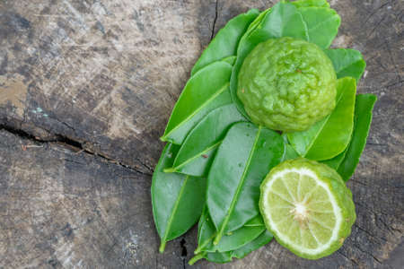 Bergamot with green leafs on the old wood backgroundの写真素材