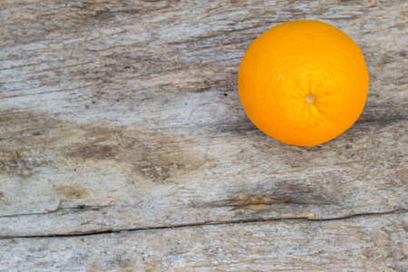 orange on the old wood backgroundの写真素材