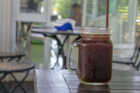 jar of lemon ice tea on wood table in coffee shopの写真素材