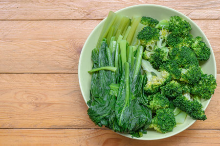Broccoli and Bok choy on wood table background.の写真素材