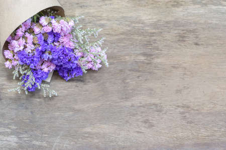 Bouquet of dried wild flowers on wood table backgroundの写真素材