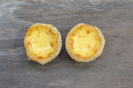 eggs tart on old wood backgroundの写真素材