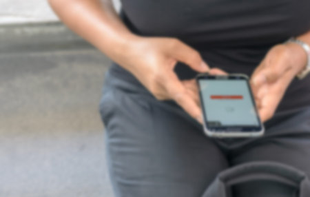 Blurred abstract background of female use smartphone.