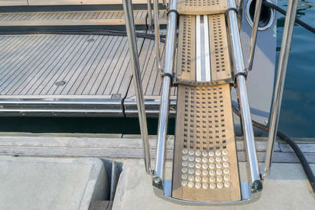 Wooden gangway on yacht staying in port , Phuket Thailandの写真素材