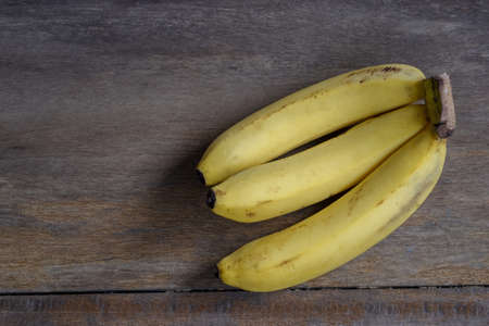 fresh bananas on wooden backgroundの写真素材