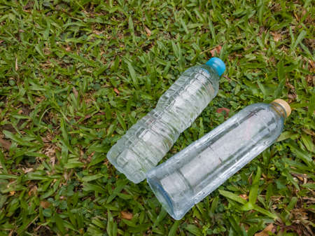 Two water bottles on grassの写真素材