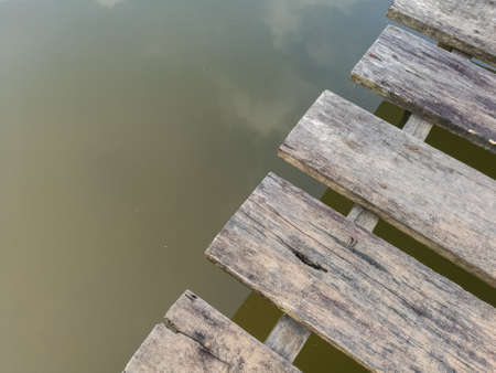 the old wood bridge with water, perspectives viewの写真素材