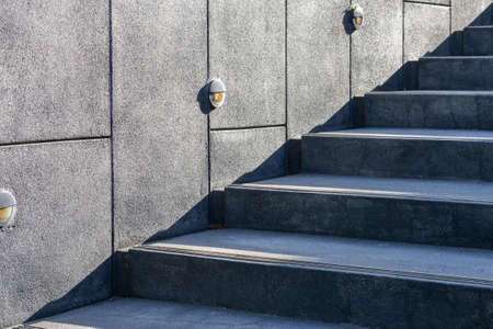 black stone staircase with cement wallの写真素材