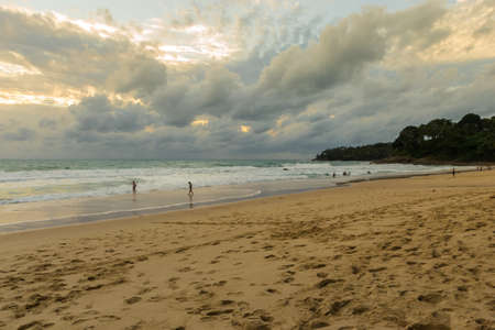 Dramatic sky and tropical beach at Surin beach Phuket island, Thailandの写真素材