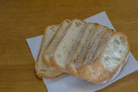 Fresh breads on wooden table backgroundの写真素材
