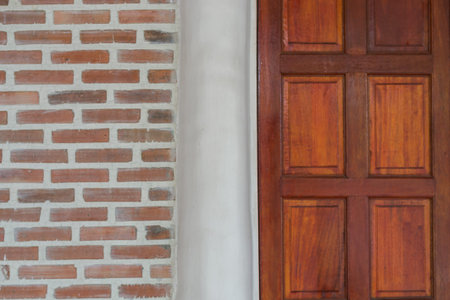 wood door with red brick wall texture background.