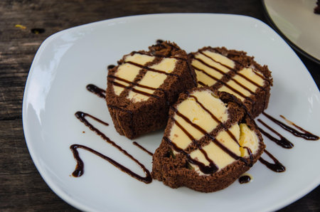 Ice cream cake in white dish  To be placed on a wooden table, Brown
