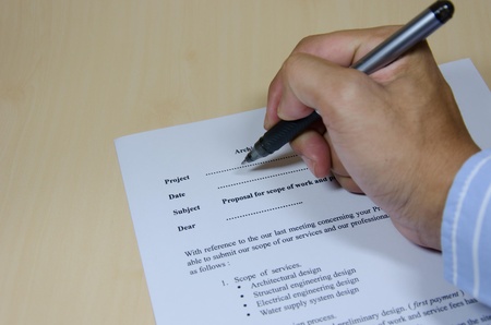 Close up of businessman signing a contractの写真素材