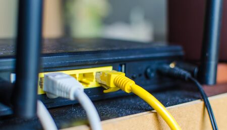 Network cable connected into a wireless routerの写真素材