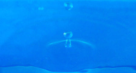 Small water drops in light blue background