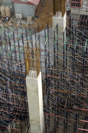 Building under construction with scaffolding on its exterior 