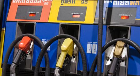 Close-up of colored fuel pumps at the petrol stationの写真素材