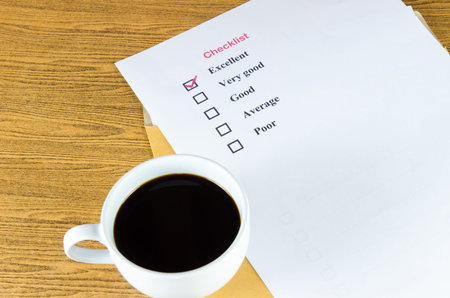 checklist coffee cup on the table.