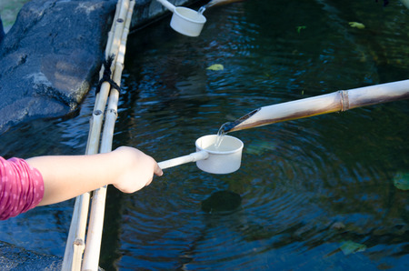 Japanese hand cleansing ritual before entering Shrineの写真素材