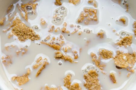 Is eating cereal with milk in the morning.の写真素材