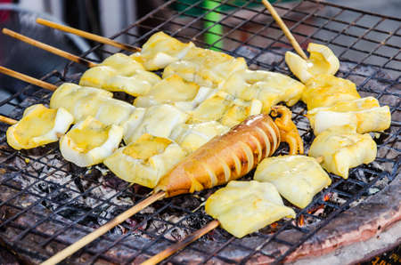Grilled fresh squid Market place on the grillの写真素材