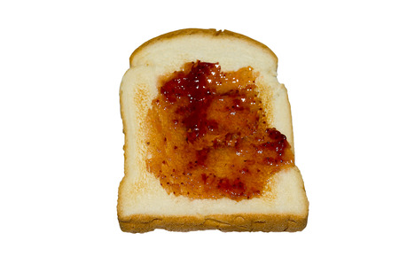 Toast with jam isolated from white background.の写真素材