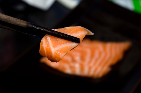 Fresh salmon fillets isolated the black background.の写真素材