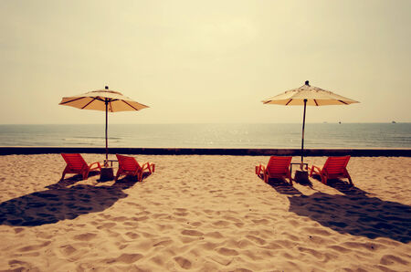 Beach chairs and beach umbrellas vintage.の写真素材