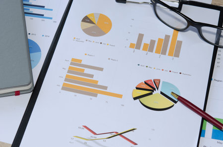 Business chart is placed on the table.