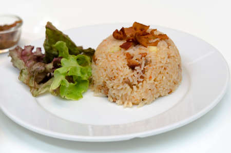 Bacon fried rice with chili on dish.の写真素材