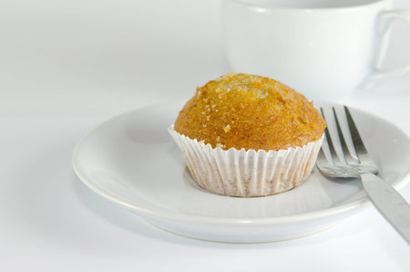 Banana muffin cake on the white background.