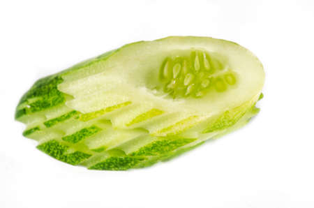 sliced cucumber isolated on white backgroundの写真素材