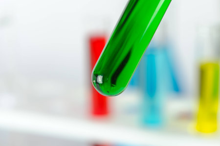 Colored liquids test tubes isolated over white backgroundの写真素材