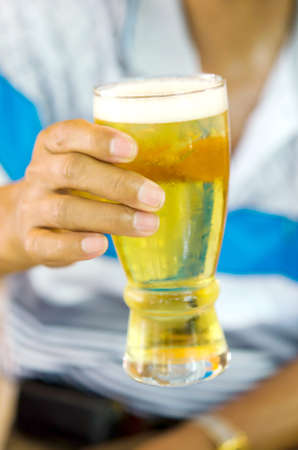 Men with a glass of beer in handの写真素材