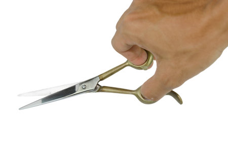 Hand with Barber Scissors isolated on the white
