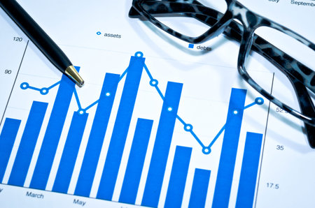 Graphs charts and pen business table.の写真素材