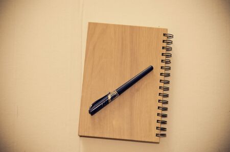 book and pen on table.の写真素材