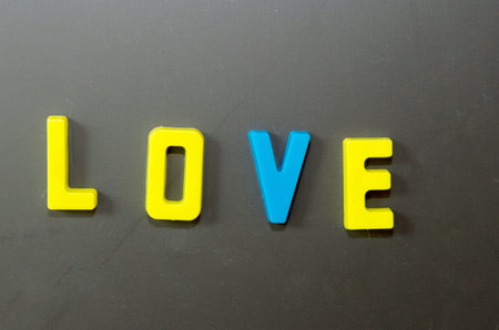 Love letters stuck on a blackboard.