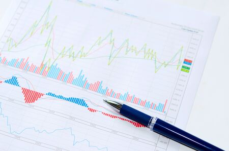 financial and business color charts and graphs on the tableの写真素材