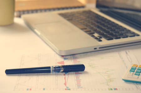 Notebook Computers ,book,pen on desk.vintage color toneの写真素材