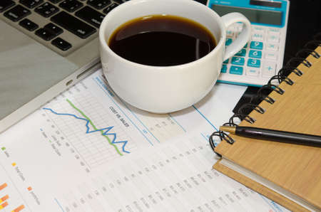 business documents computer and pen on table,の写真素材