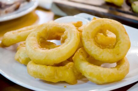 onion rings on a plateの写真素材
