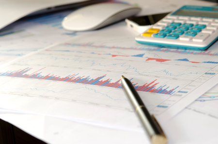 business documents with charts growth mouse and pen. workplace businessman